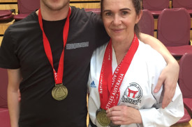 Team kata members Tobi and Jill Cole proudly present their gold medals.