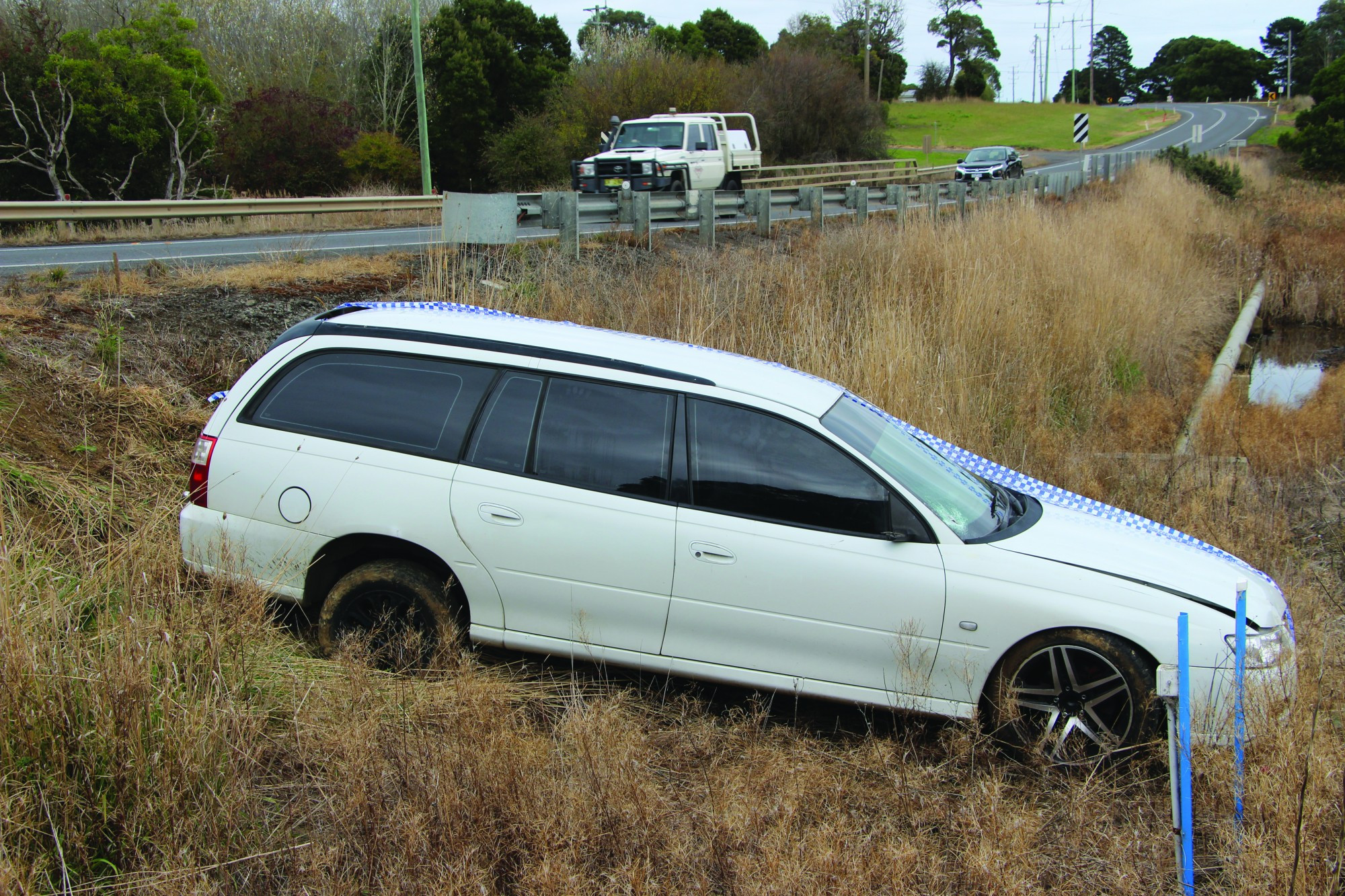 Stuck: Police found a Holden Commodore abandoned in a ditch in Garvoc, last week.