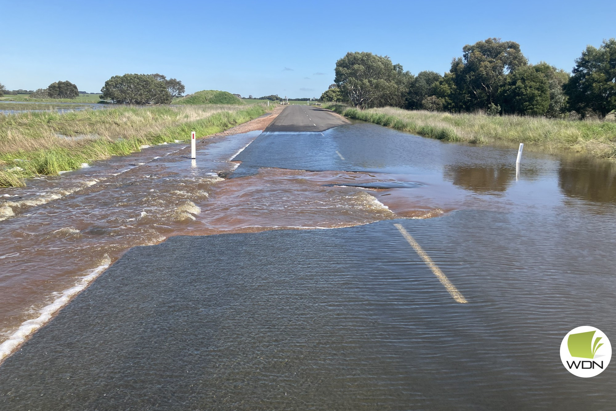 Caution urged: Moyne Shire Council mayor Ian Smith has pleaded with drivers to avoid flooded roads after council staff witnessed a number of drivers ignore road closures on a dangerous stretch of Connewarren Lane in Mortlake.