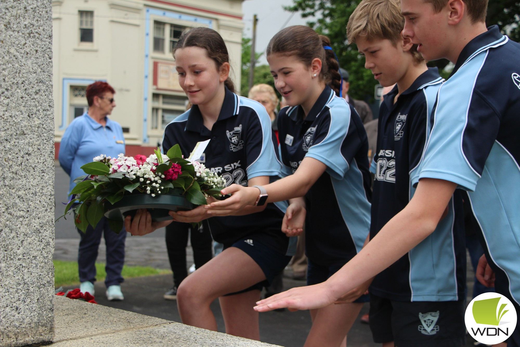 Students from St Thomas’ Primary School paid their respects.