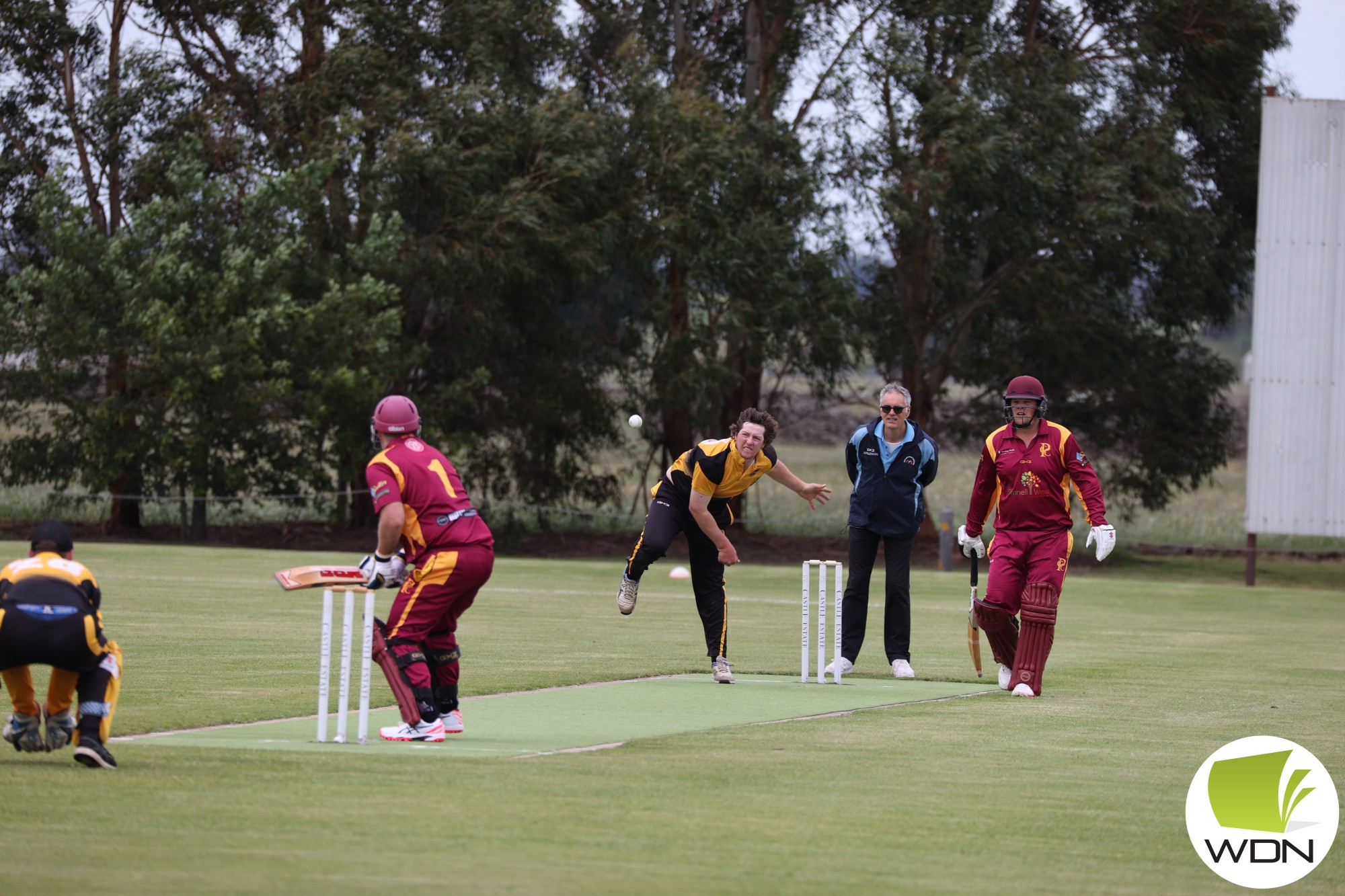 Determined: Jake Fowler sends one down the pitch during last Saturday’s clash with Pomborneit.