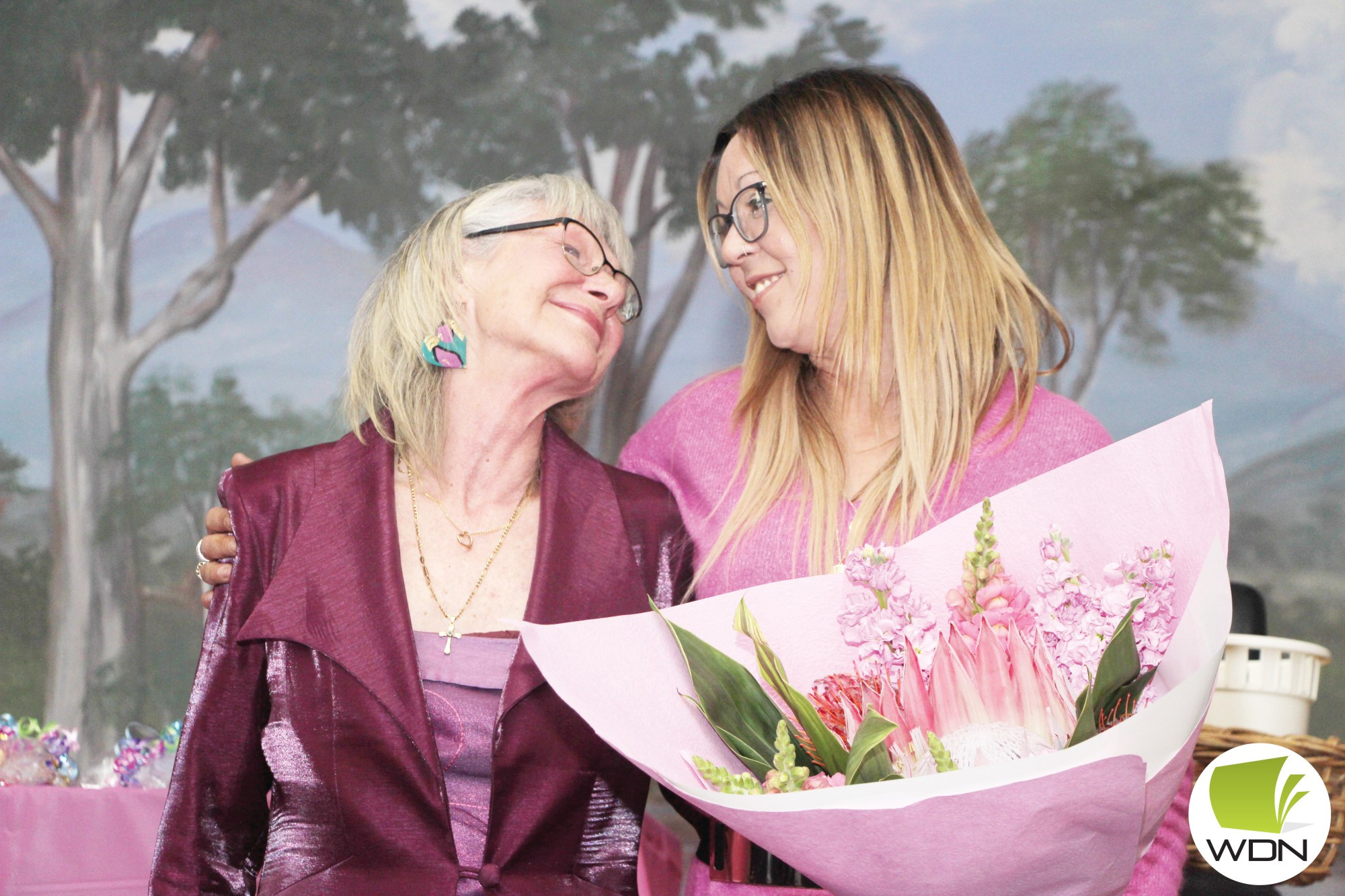 Letting light shine: Independent candidate for Lowan Amanda Mead (right) presents cancer survivor Deb Etherton with a bouquet of flowers in appreciation for her fundraising efforts.