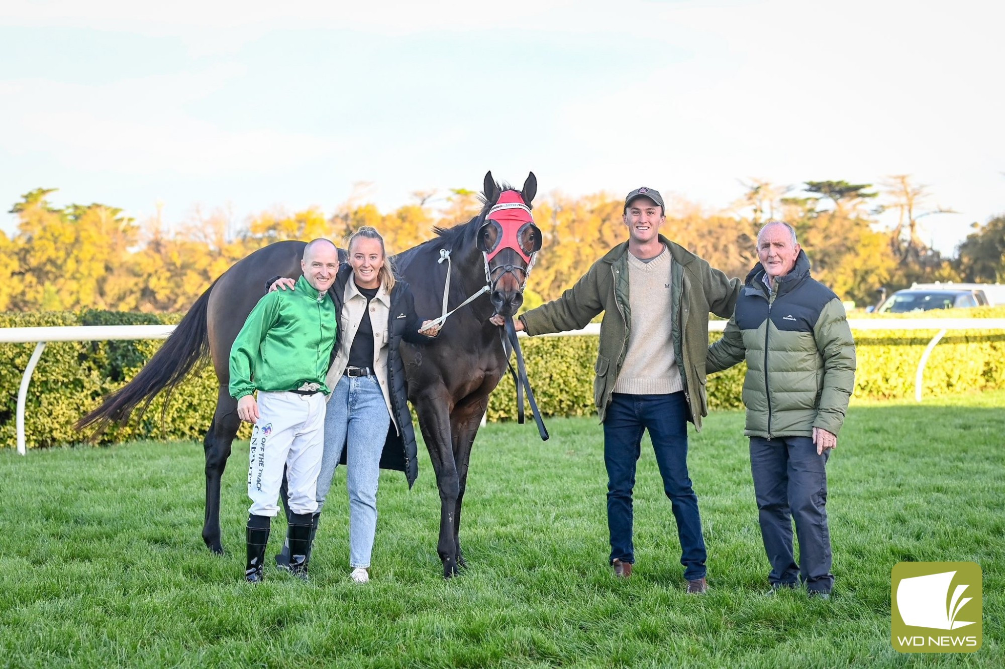 United in celebration: Local trainers Harriet Place and grandfather Denis Daffy (right) celebrate Port Louis’ victory at Terang with jockey Craig Newitt and Harriet’s brother Angus.