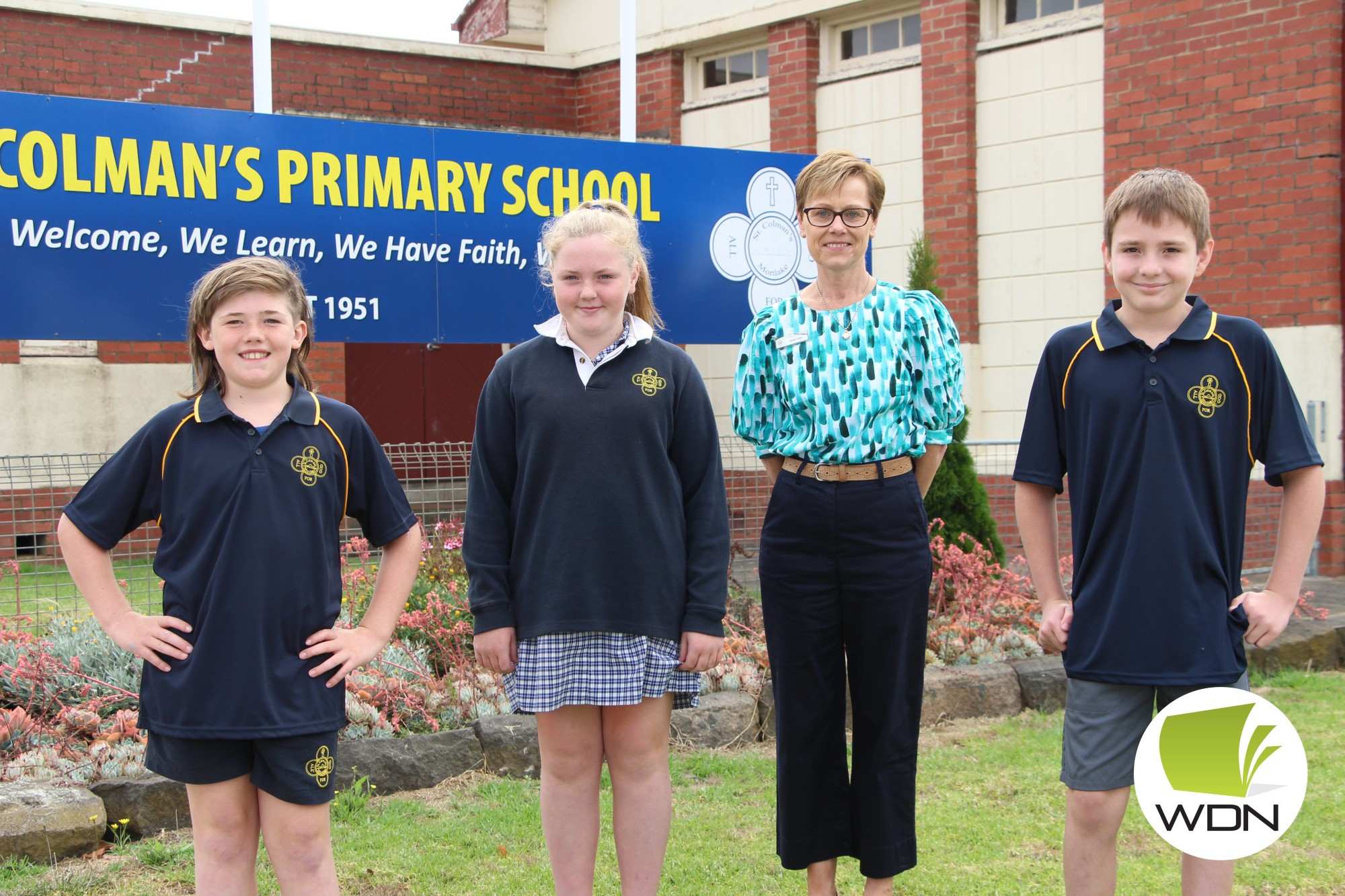 St Colman’s Primary School student leaders (from left) Spencer O’Brien, Billie Carmody and Noah McKenzie welcomed new school principal Janet Cain this week.