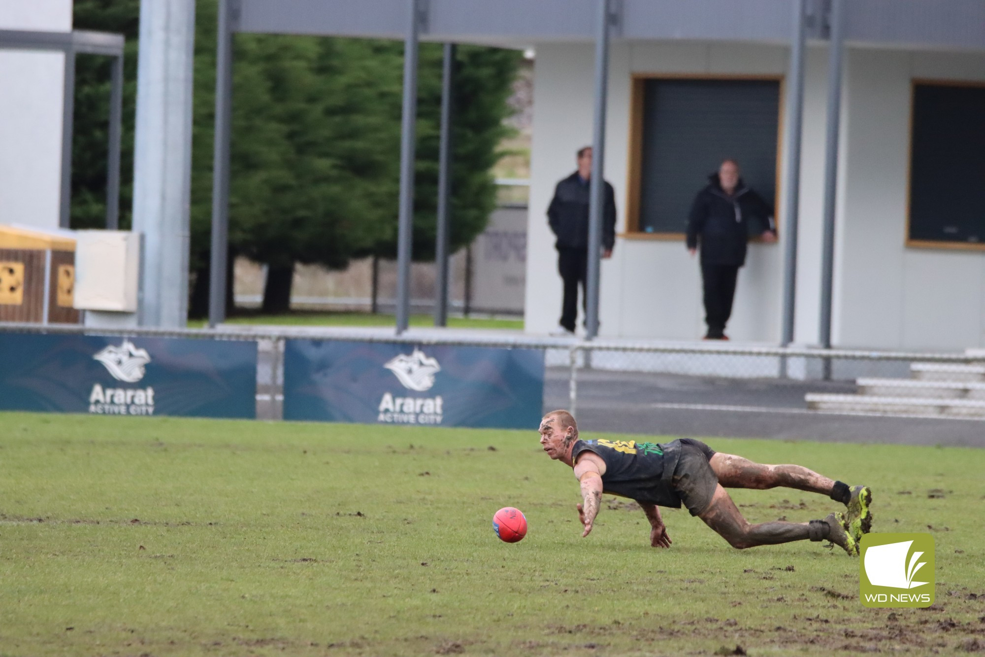 Damien Pemberton works hard for the ball.