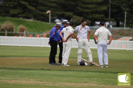 Mortlake captain Todd Lamont discusses the pitch. 