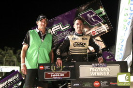 Dylan Willsher accepts the $1000 cheque from Warrnambool’s Les Speed. Photo Geoff Rounds 