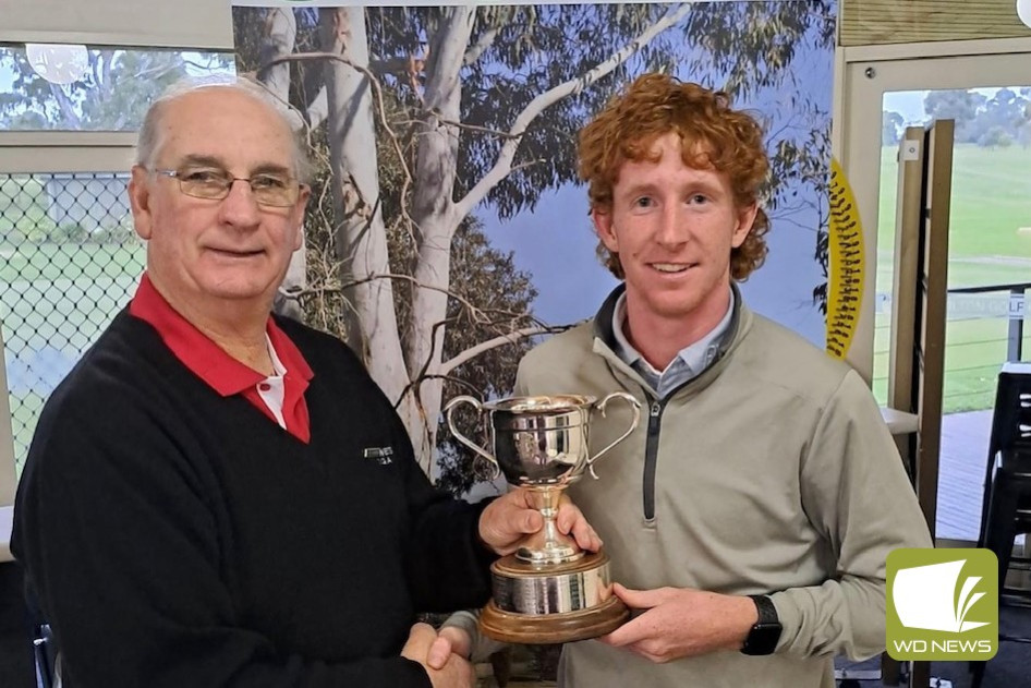 Terang golfer Fred Beasley receives the KG Horne trophy.