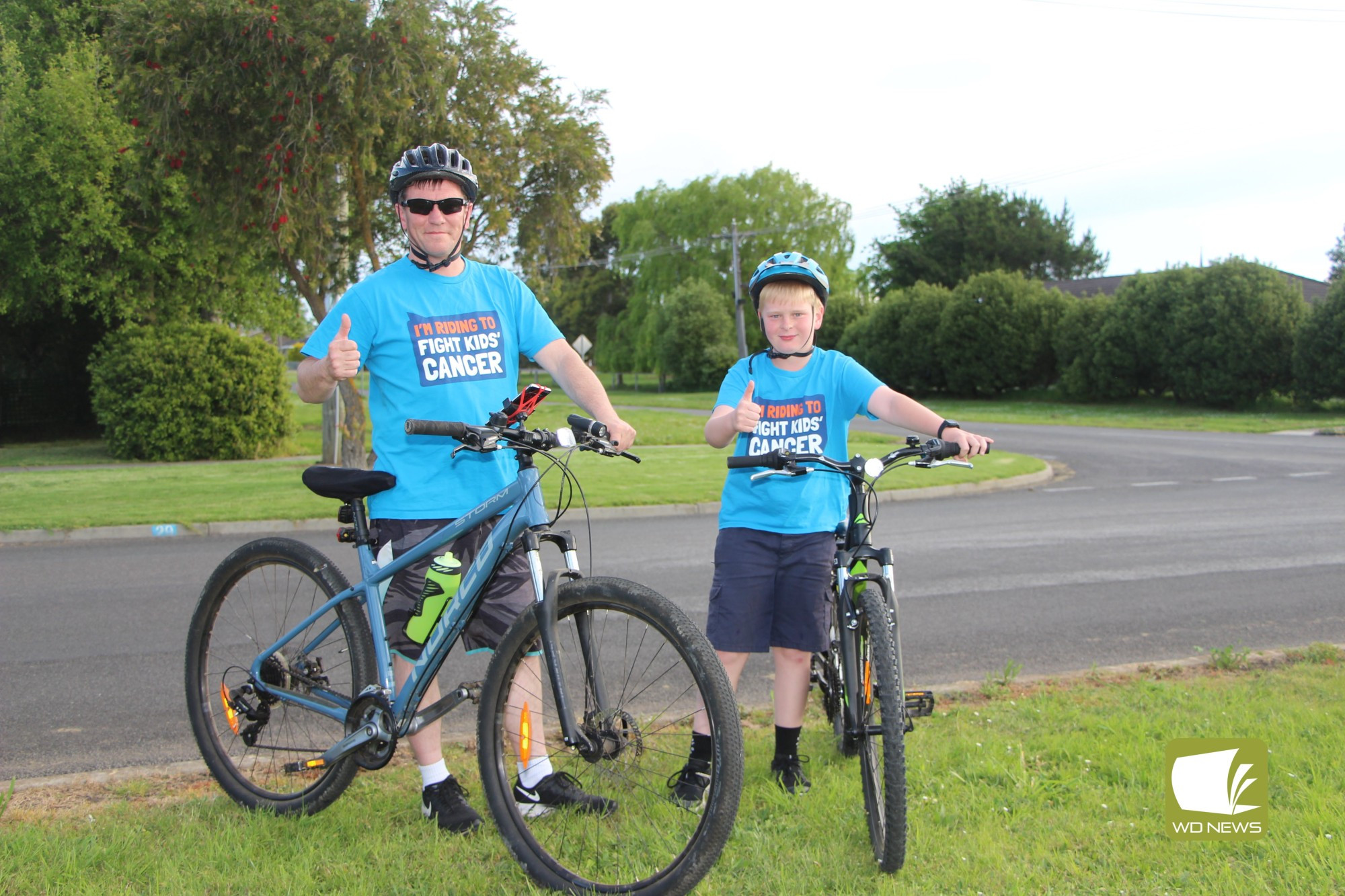 For those we love: Terang’s Riley and Lee McIntosh are aiming to ride 100 kilometres this month in a bid to raise funds in support of children battling cancer.
