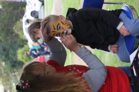 Zander Van Dijk, 2, from Cobden gets his face painted. 