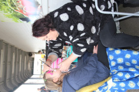 Lillian Hogan, 9, from Geelong gets her face painted at the spring festival. 