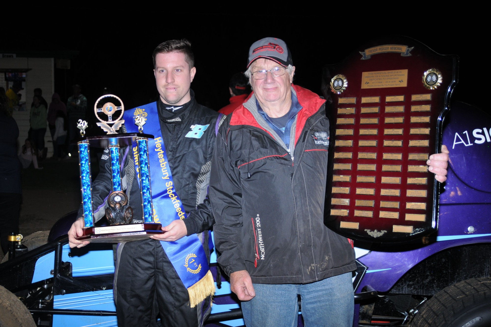 Trevor Podger Memorial winner Jamie May (left) was presented with his trophies by Trevor’s brother, Neil. Photo courtesy Donnas-Photos