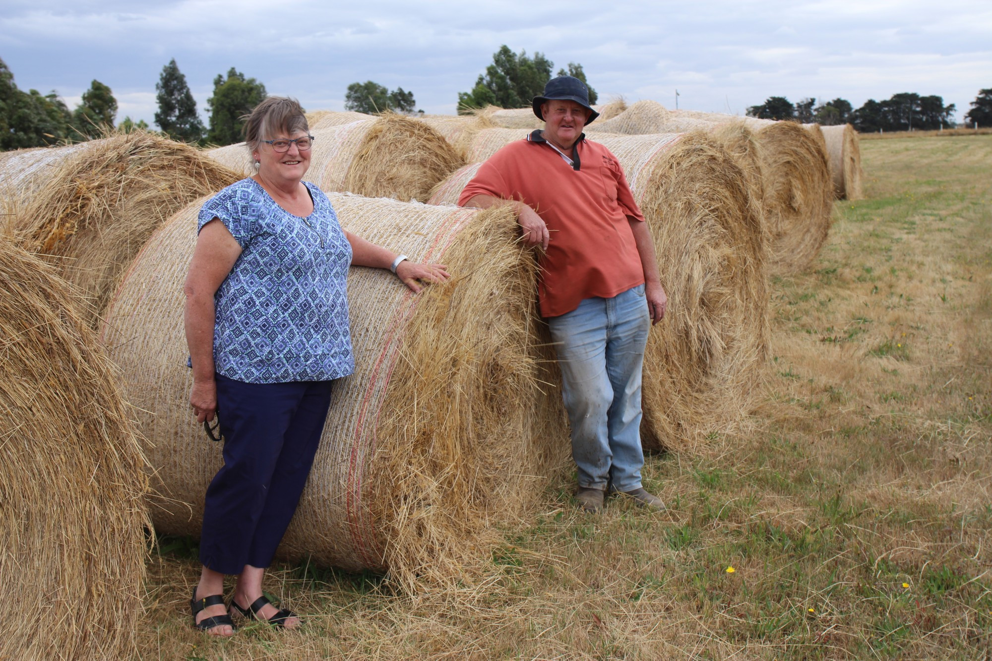 Donation: Cobden South Western District Restoration Group committee members Helen and Russell Smith with the group’s hay bales they are donating to drought relief.