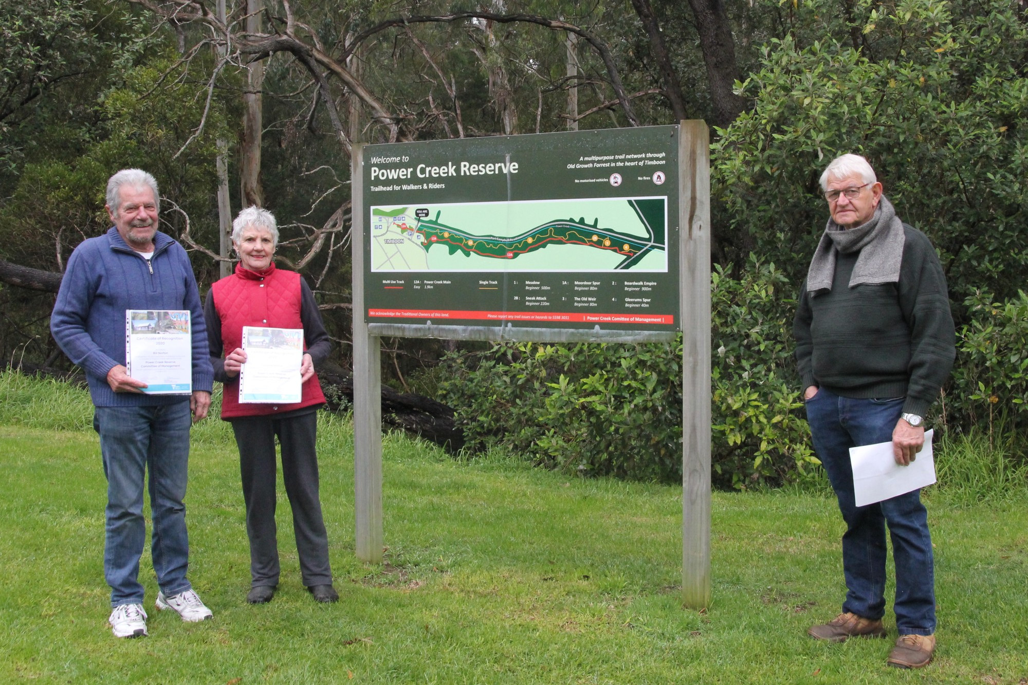 Thank you: Power Creek Reserve Committee member Peter Pope (right) thanks volunteers Bill and Lorraine Norton for their efforts over the years.