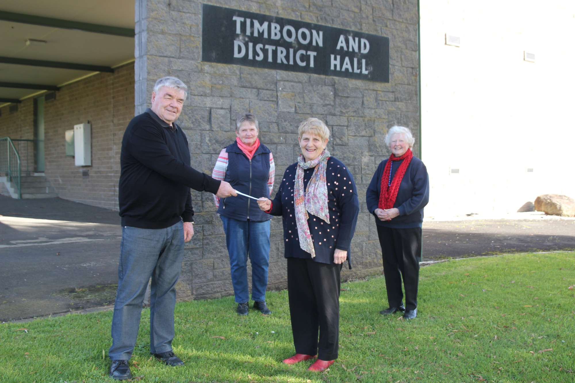 Funding: Timboon and District Hall Committee chairperson Keith Whitford thanks TOPS co-ordinator Brenda Parfett for the op shop’s support.