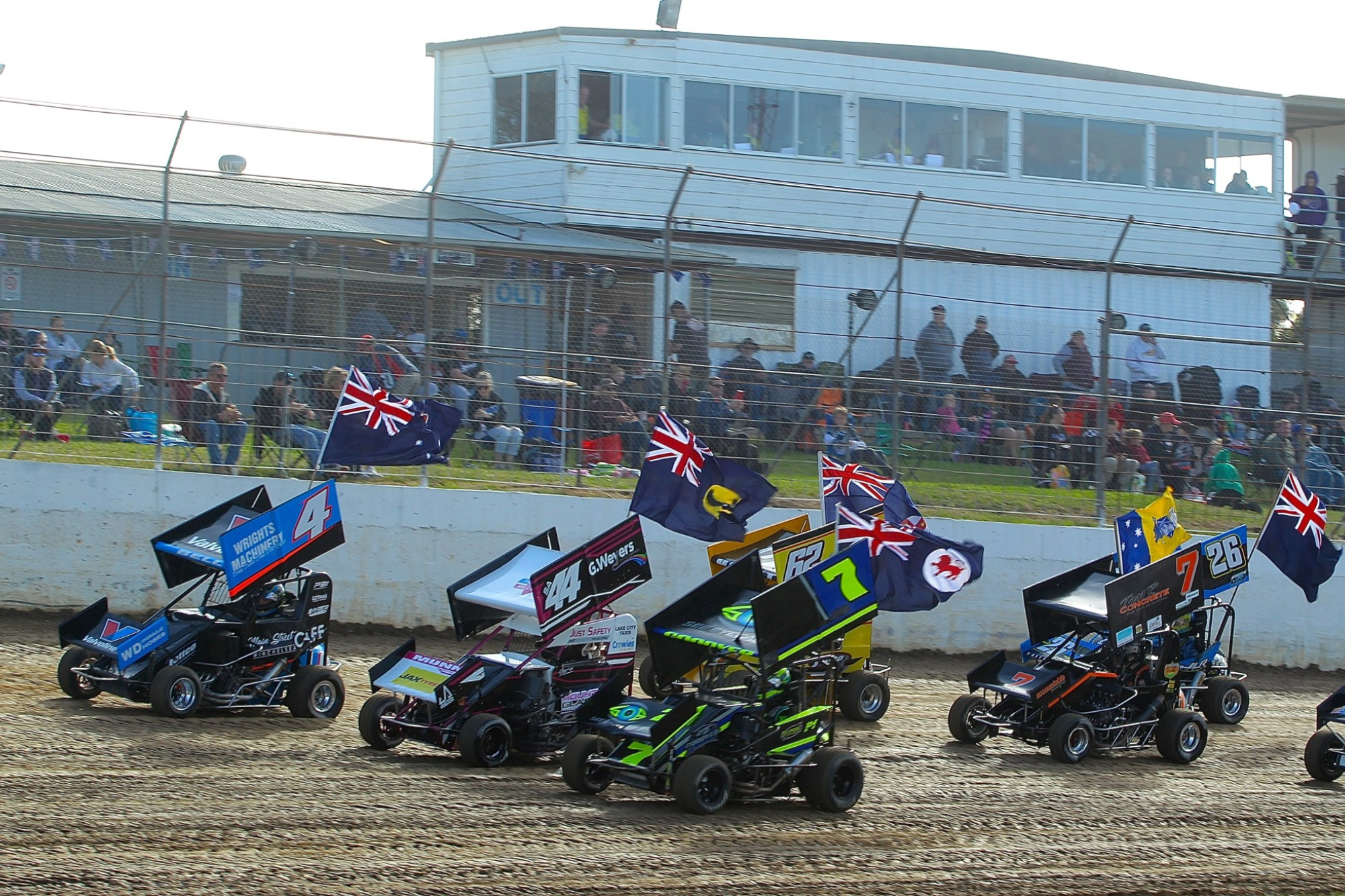 The Simpson Car Club was forced to bring its season to a premature close in the midst of the COVID-19 pandemic. Pictured are cars and drivers displaying the flags of their home states and territories during the Australian Formula 500 Championship held at Simpson Speedway last December. Photo courtesy Geoff Rounds Photography