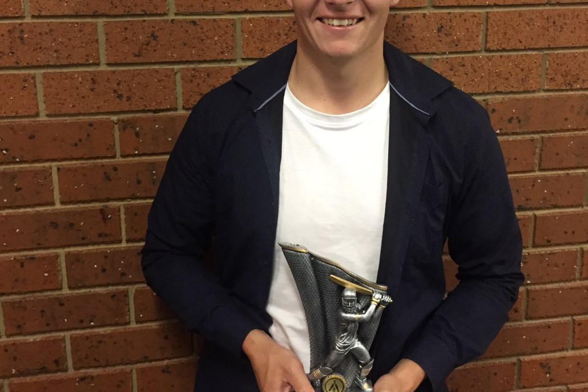 Simon Harkness pictured with his club leading runs scorer award from his last season with the Rebels in 2018/19.