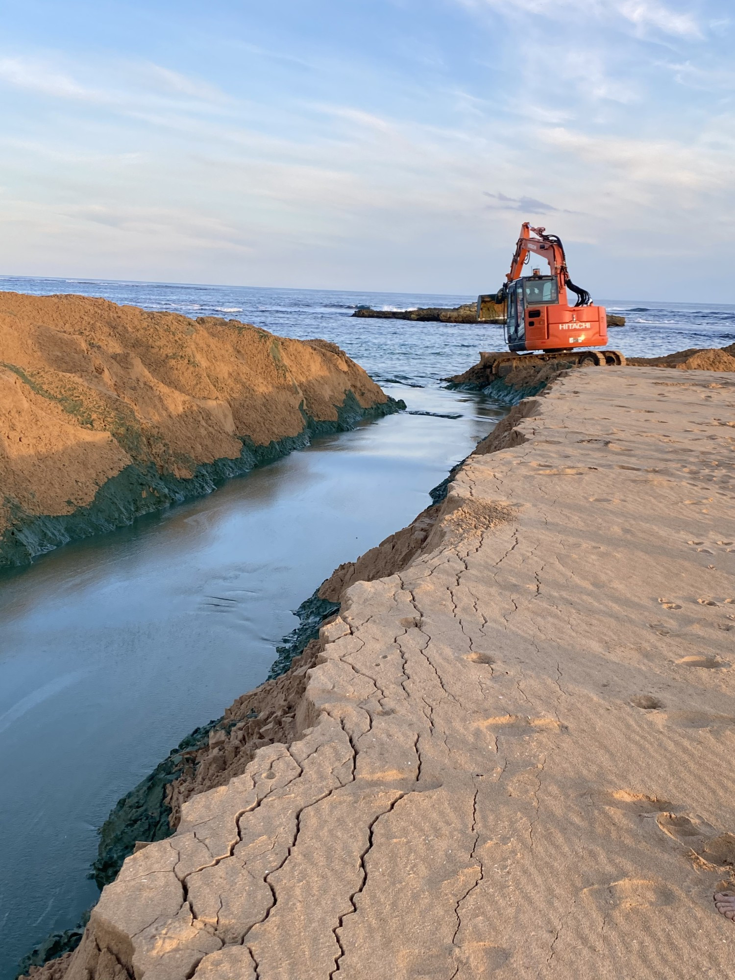 Open again: Water is once again flowing between Curdies River Estuary and the ocean at Peterborough.