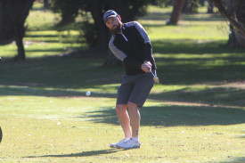 Daniel Oakley chips toward the second hole. 