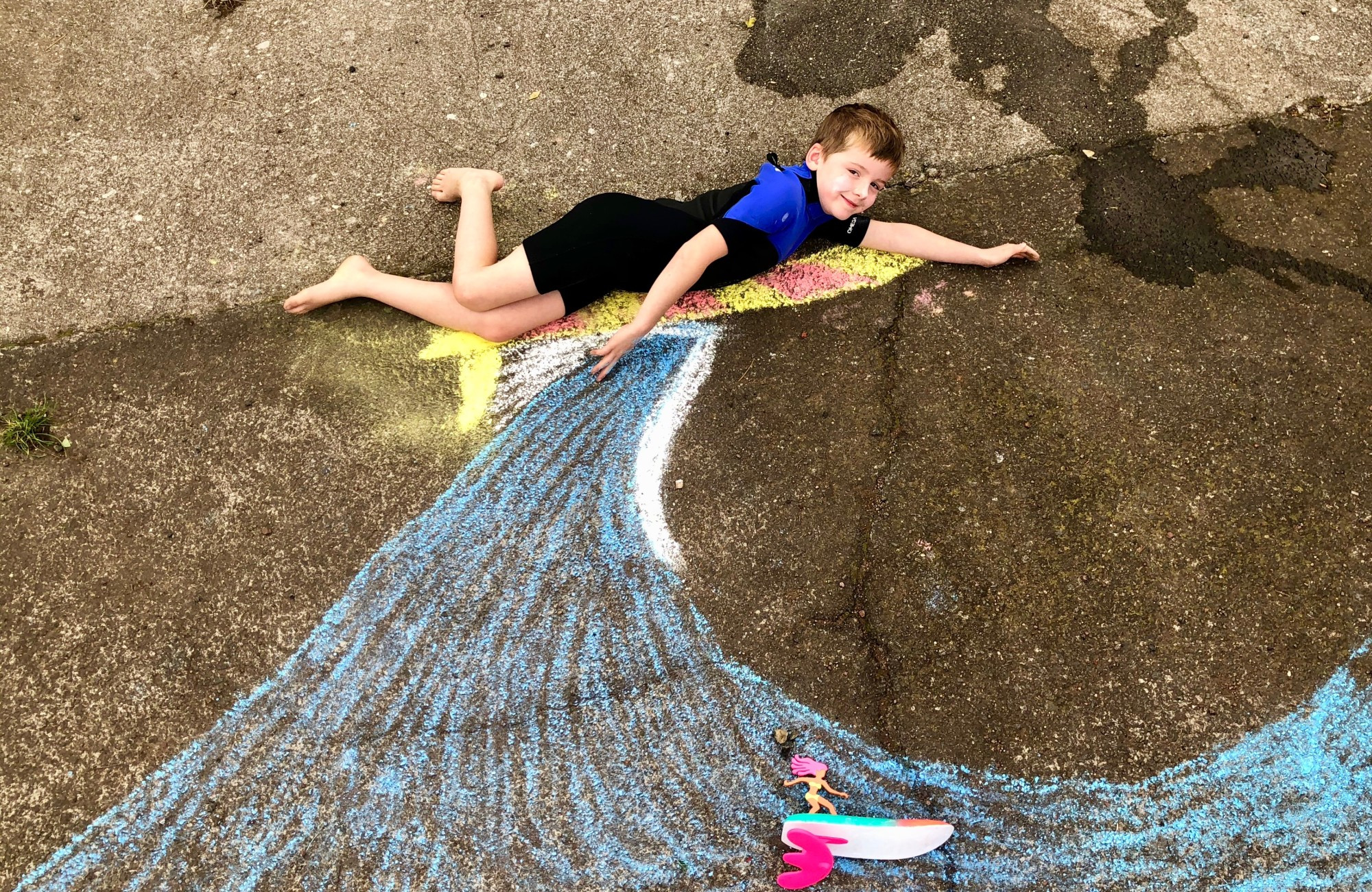Blast off: Dane Nicholls (8), Elise Nicholls (6) and little brother Callum Nicholls (3) have shared a space obsession during isolation and have used that as the basis for an interactive art mural.
