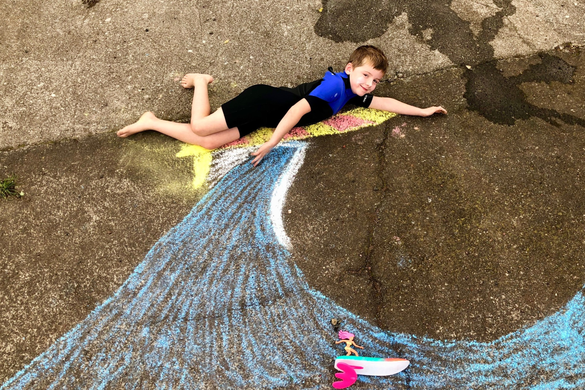 Becoming the art: Timboon P-12 School student Rory Hollick gives interactive chalk drawing a go.