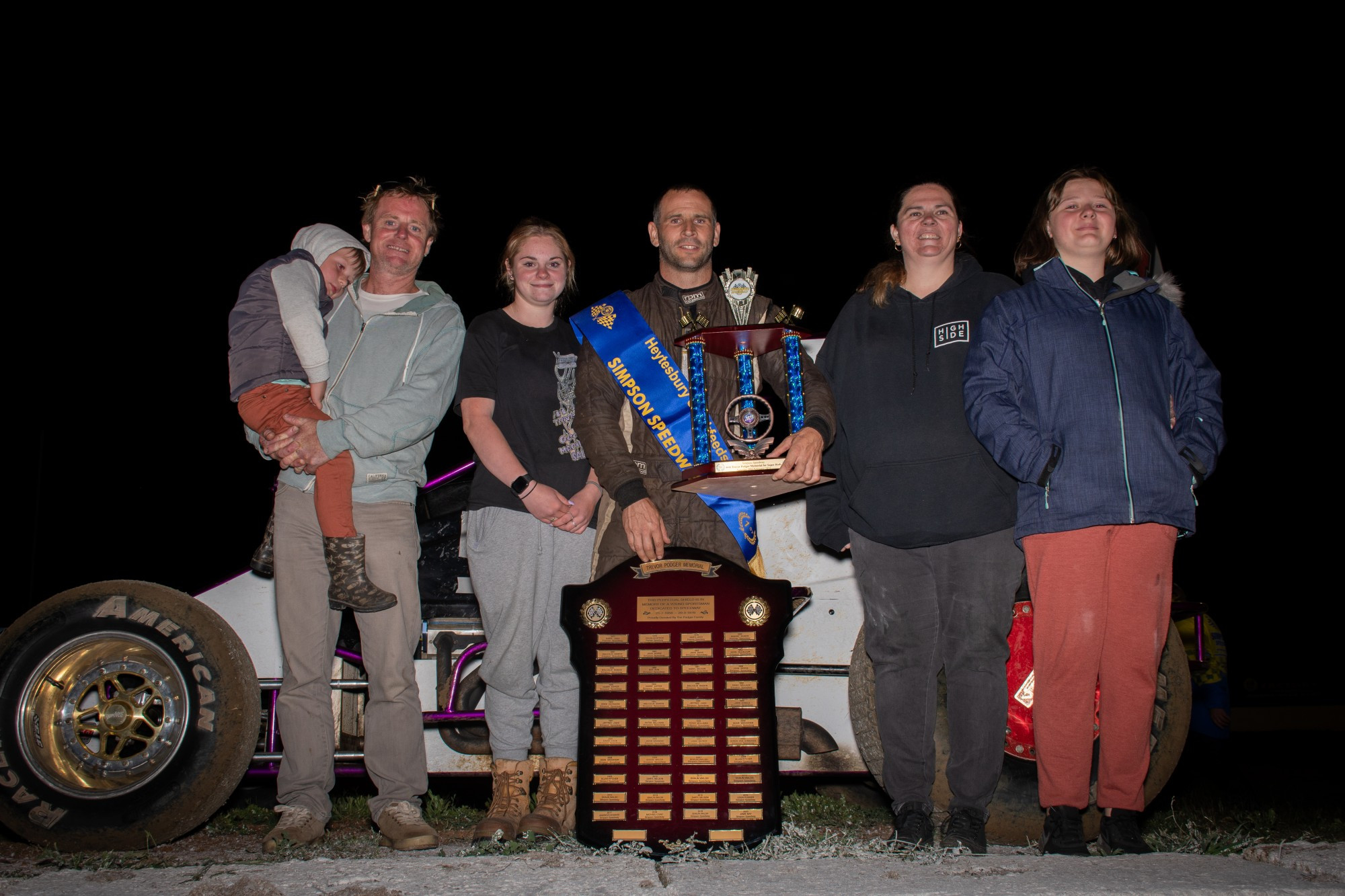 Colac’s Neville Gange receives the Trevor Podger Memorial trophy from the Podger family after winning the prestigious event at Simpson Speedway on Saturday night. Photo courtesy Aidan Freeman