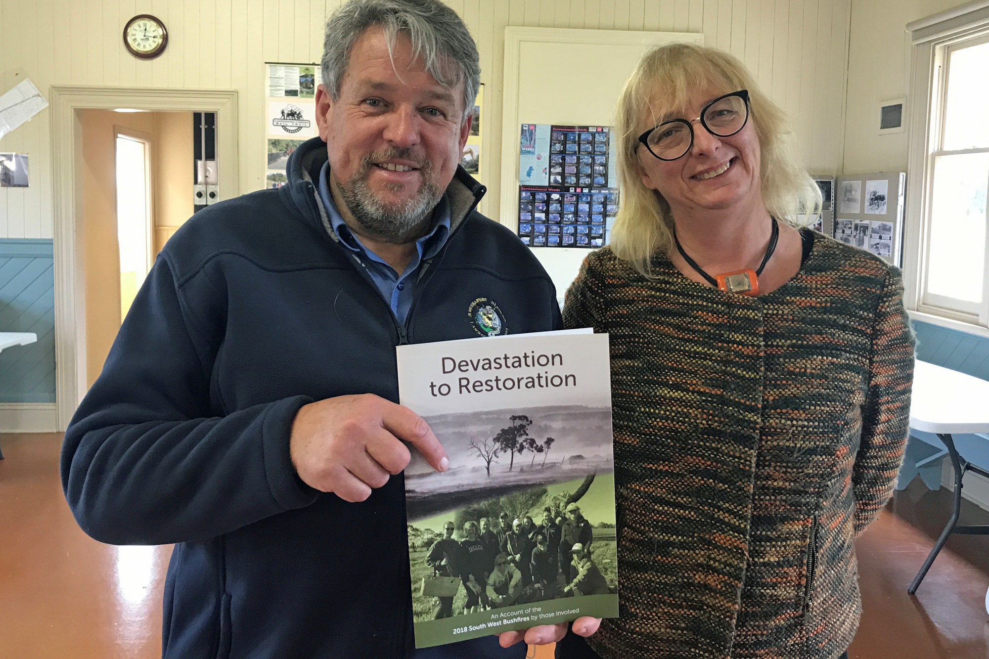 Engaging read: HDLN landcare co-ordinator Geoff Rollinson with author Kirsty Hawkes at the launch of ‘From Devastation to Restoration’ detailing the experiences of landholders and those involved in the follow-up response after the St Patrick’s Day fires.