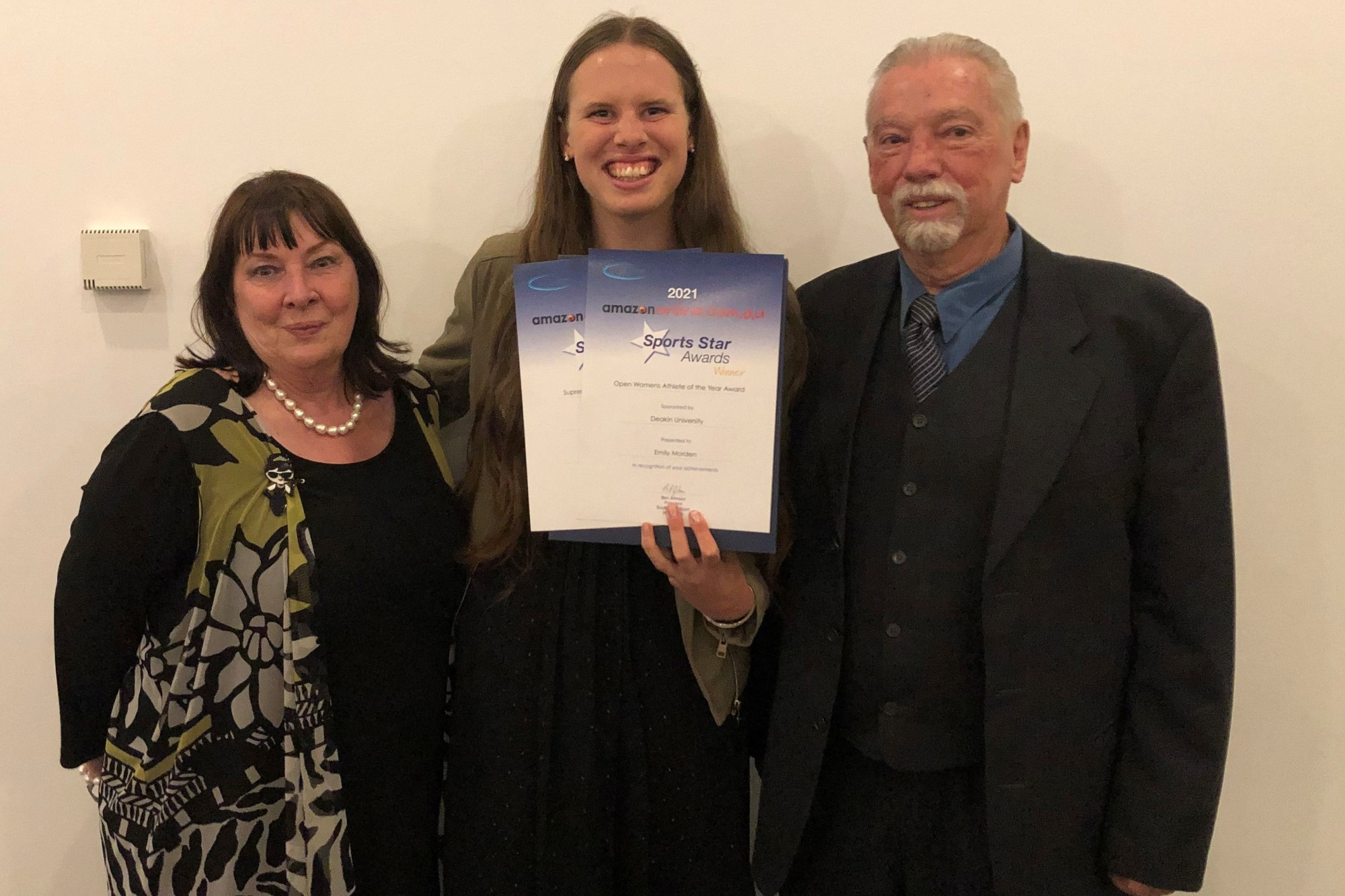 Recognition: Emily Morden celebrates receiving two Amazon Sport Star awards with her coach Phil Molesworth (right) and his wife Ruth.