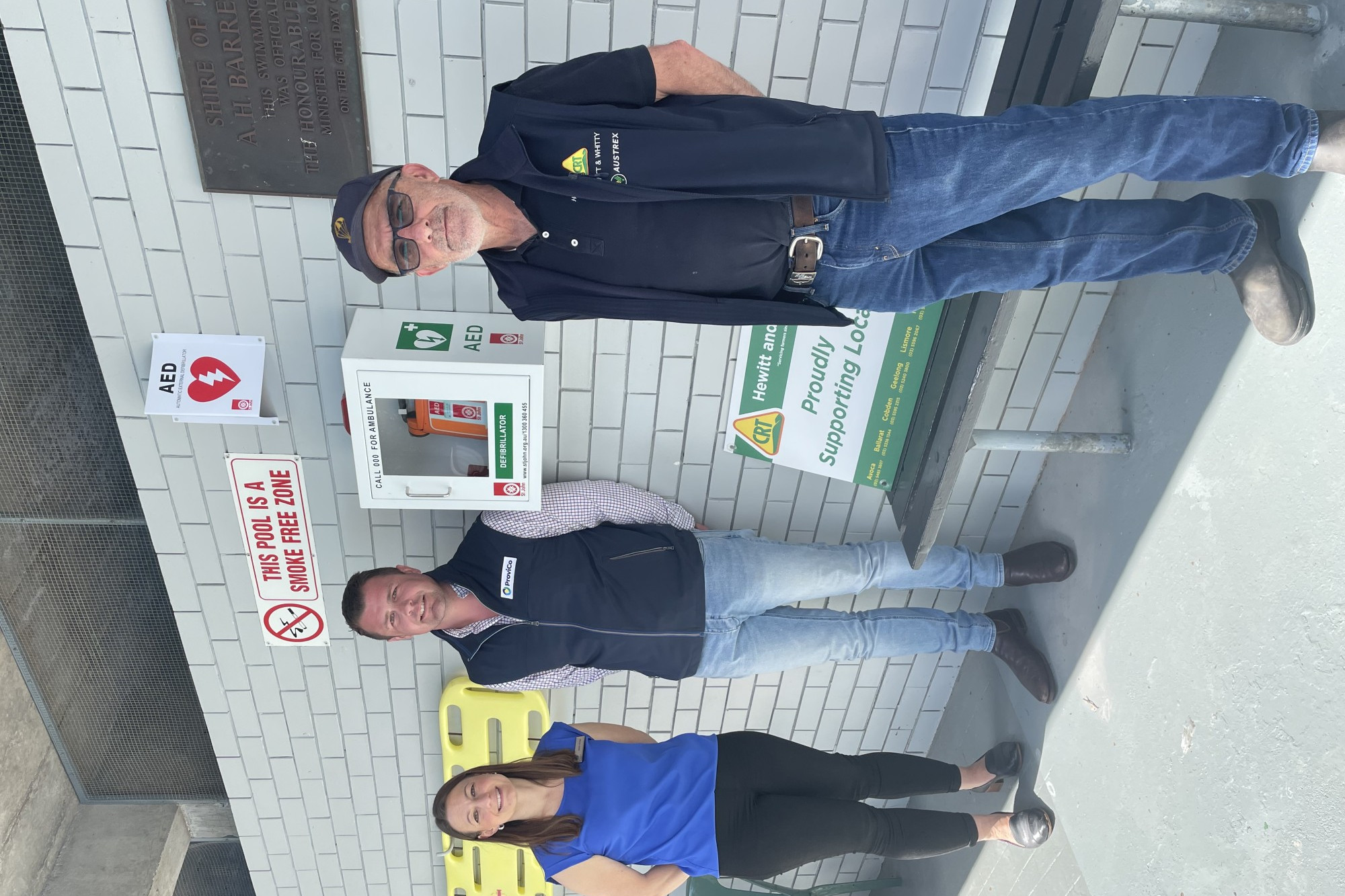 Donation appreciated: Corangamite Shire Council’s Jane Hinds, ProviCo’s Tom Ward and Hewitt and Whitty’s Denis Delaney celebrate a defibrillator being installed at the Cobden Pool.