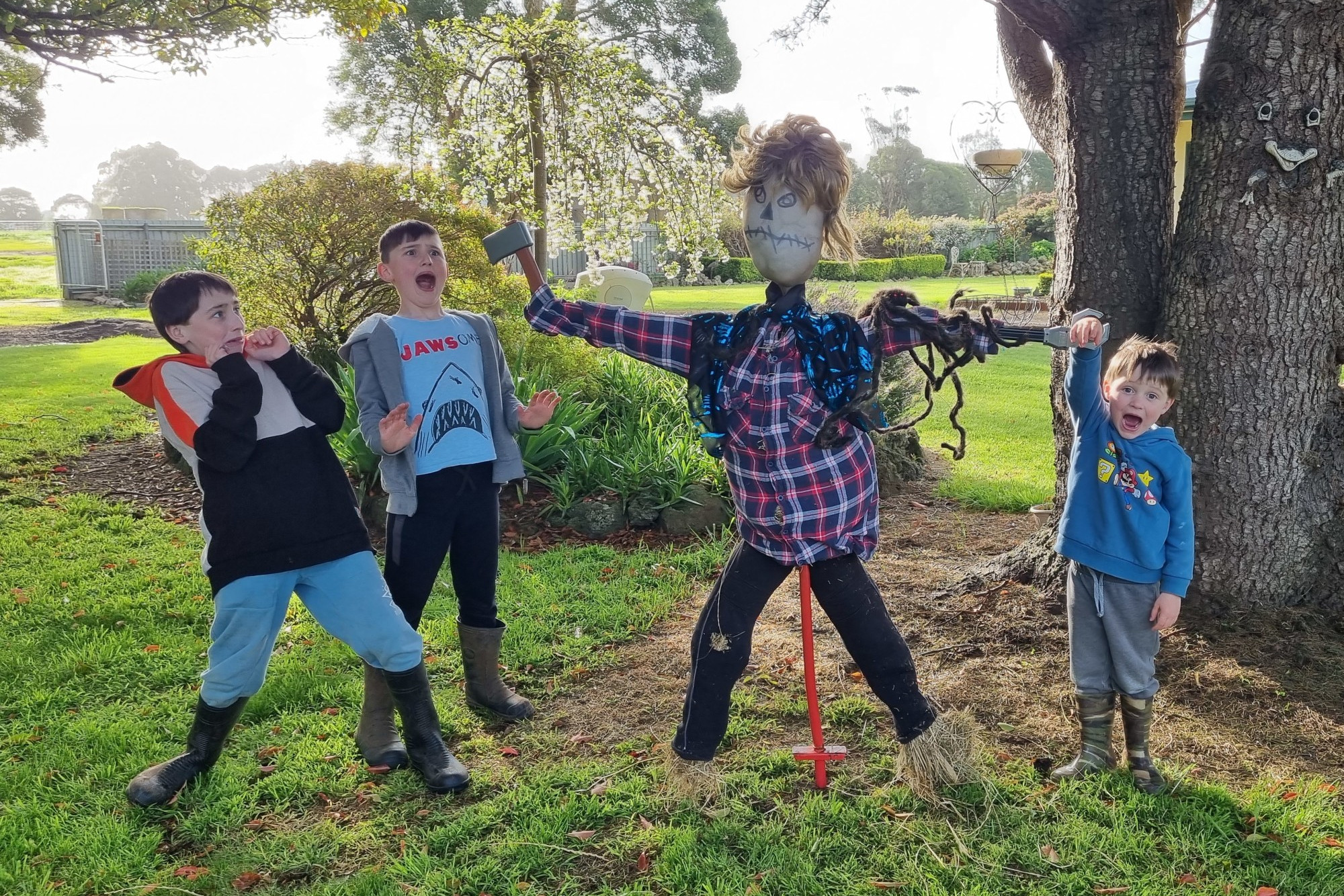 Congratulations: Royce, Lincoln and Henry Rowe with their winning scarecrow in the Simpson scarecrow competition held over the past month.