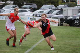 Paul Pekin does his best to keep the play alive for the Bombers. 