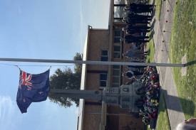 Community group representatives laid wreathes during the service. 