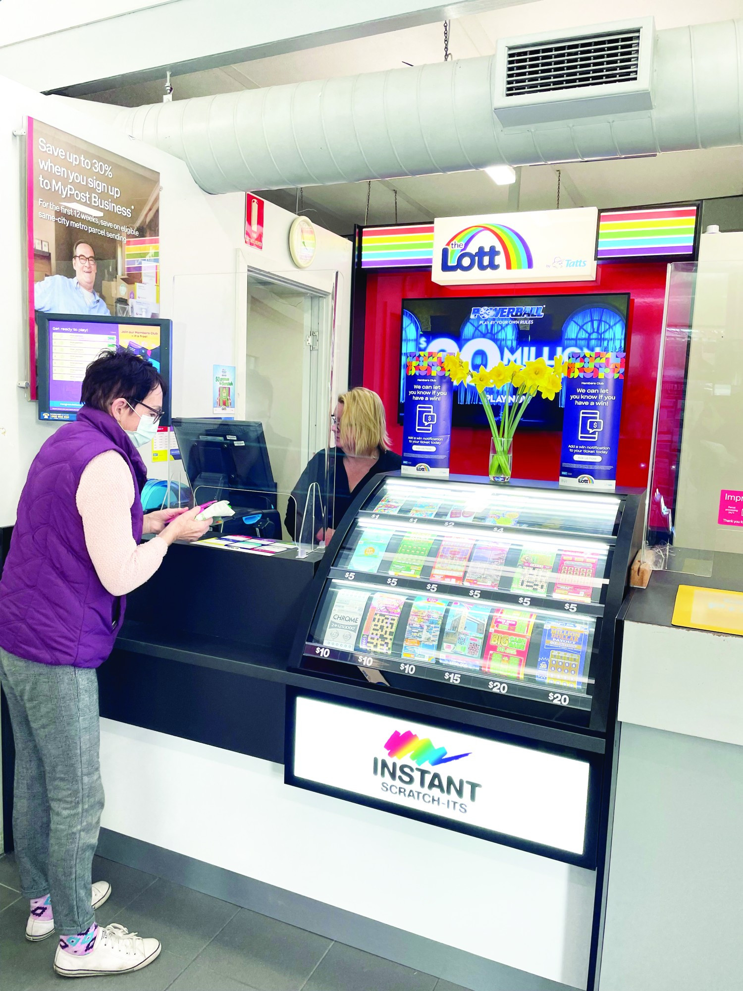 Good luck: Angie Hunter helps serve a customer with the new Tattslotto outlet at the Cobden Post Office officially open.