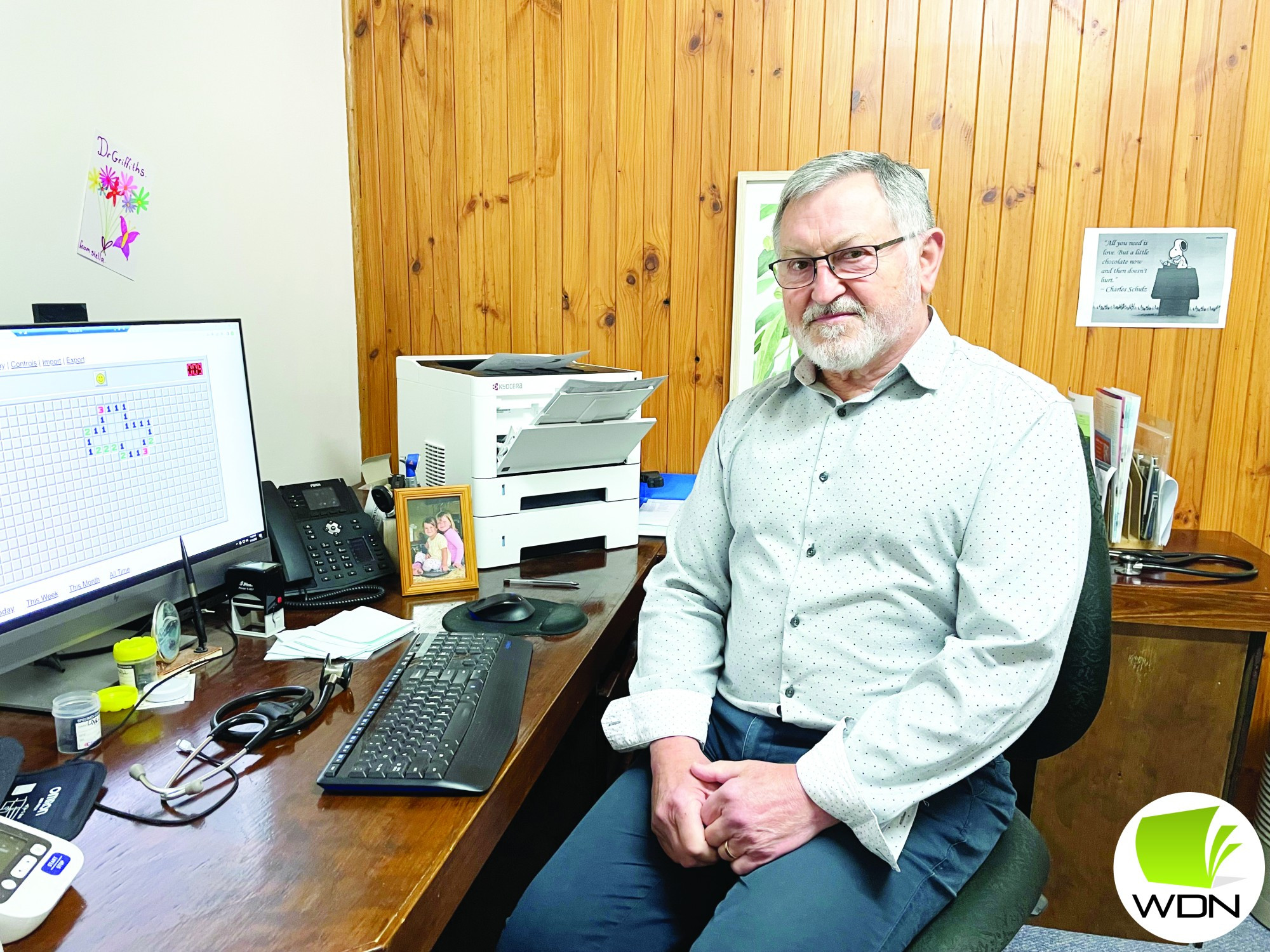 Fond memories: Dr Andrew Griffiths, pictured with wife Wendy and long-time receptionist Wilma White have just weeks left at the Curdie Street based clinic.