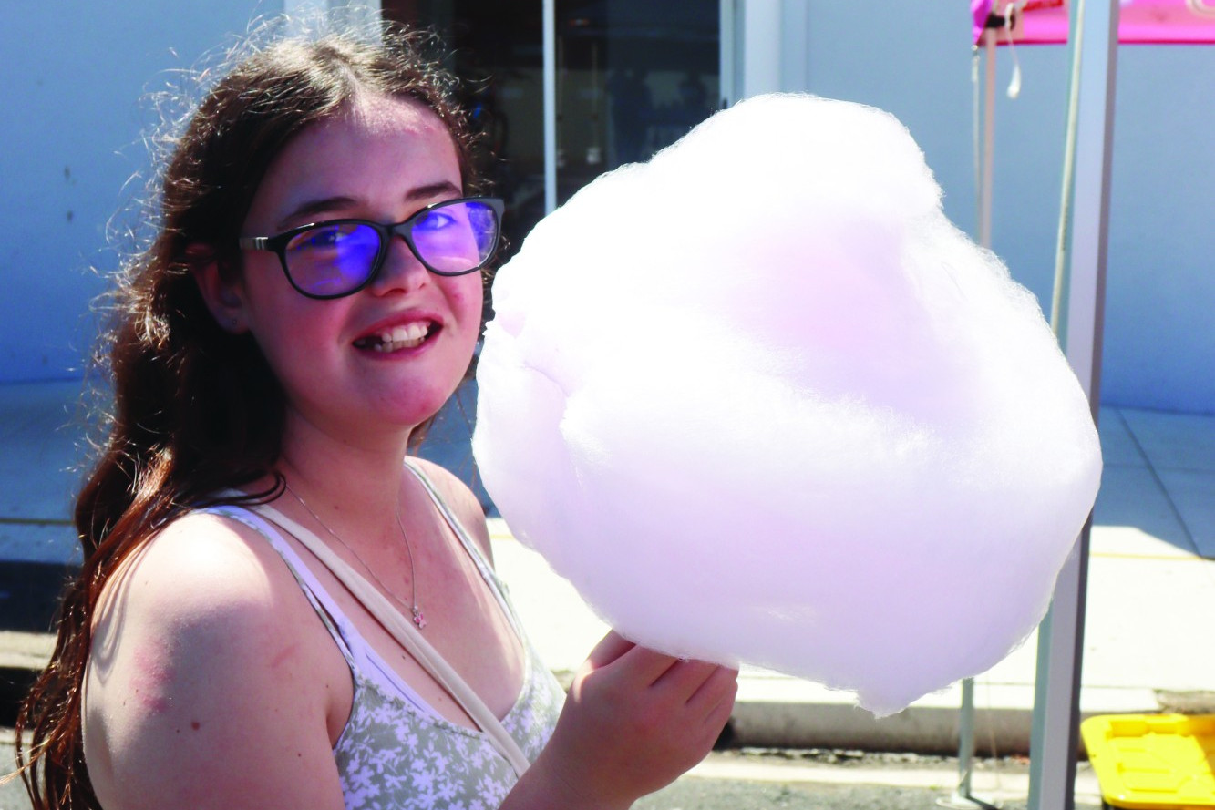 Olivia Benson enjoys some fresh fairy floss at the Cobden Curdie Street Christmas.