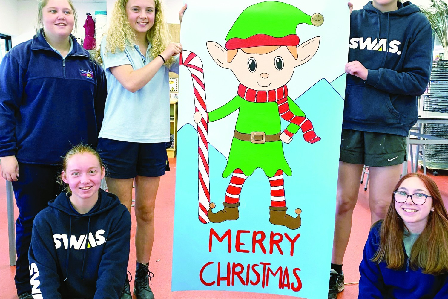 Fun: Timboon P-12 School students helped create a series of Christmas inspired flags for the town’s CBD.