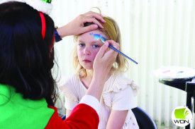 Eva Watson, 7, gets her face painted. 