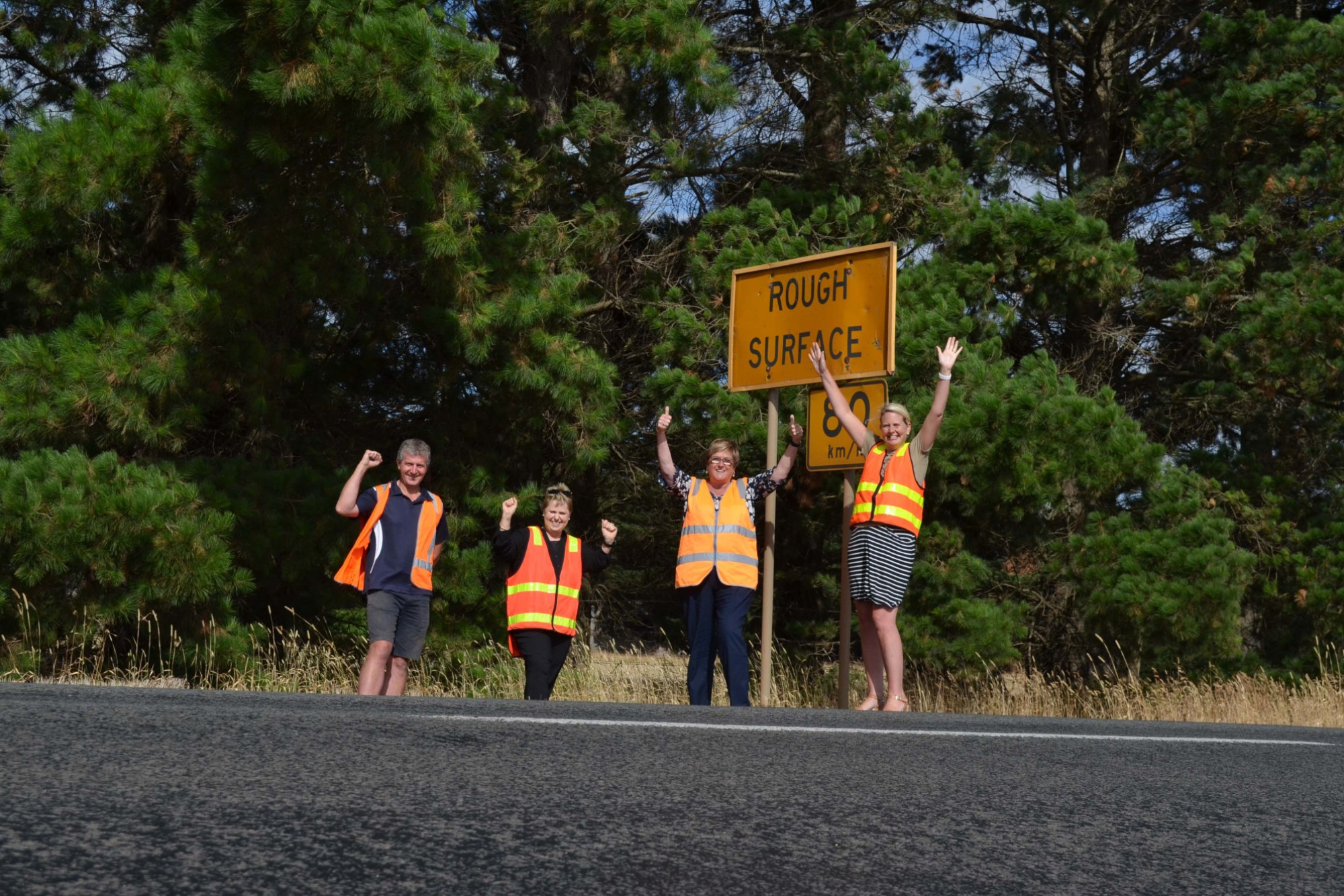 Jumping for joy: Local residents Andrew Chivell (left) and Paula Poole, Corangmite Shire mayor Ruth Gstrein and South Ward councillor Jo Beard are delighted the $3.7 million upgrade to Lavers Hill-Cobden Road started on Monday.