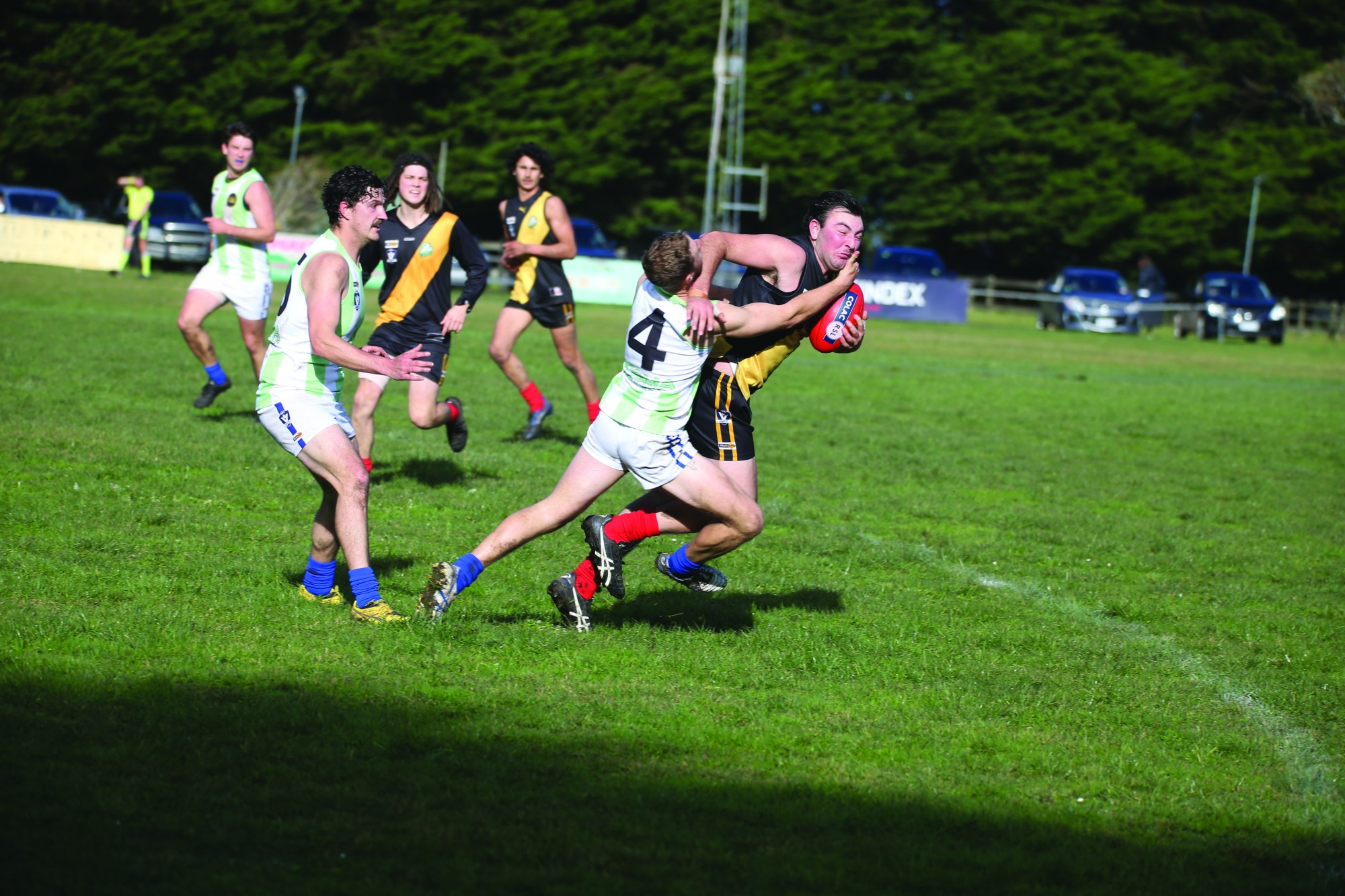 Lachie Gass works hard to get free of South Colac’s Mitchell Perkins.