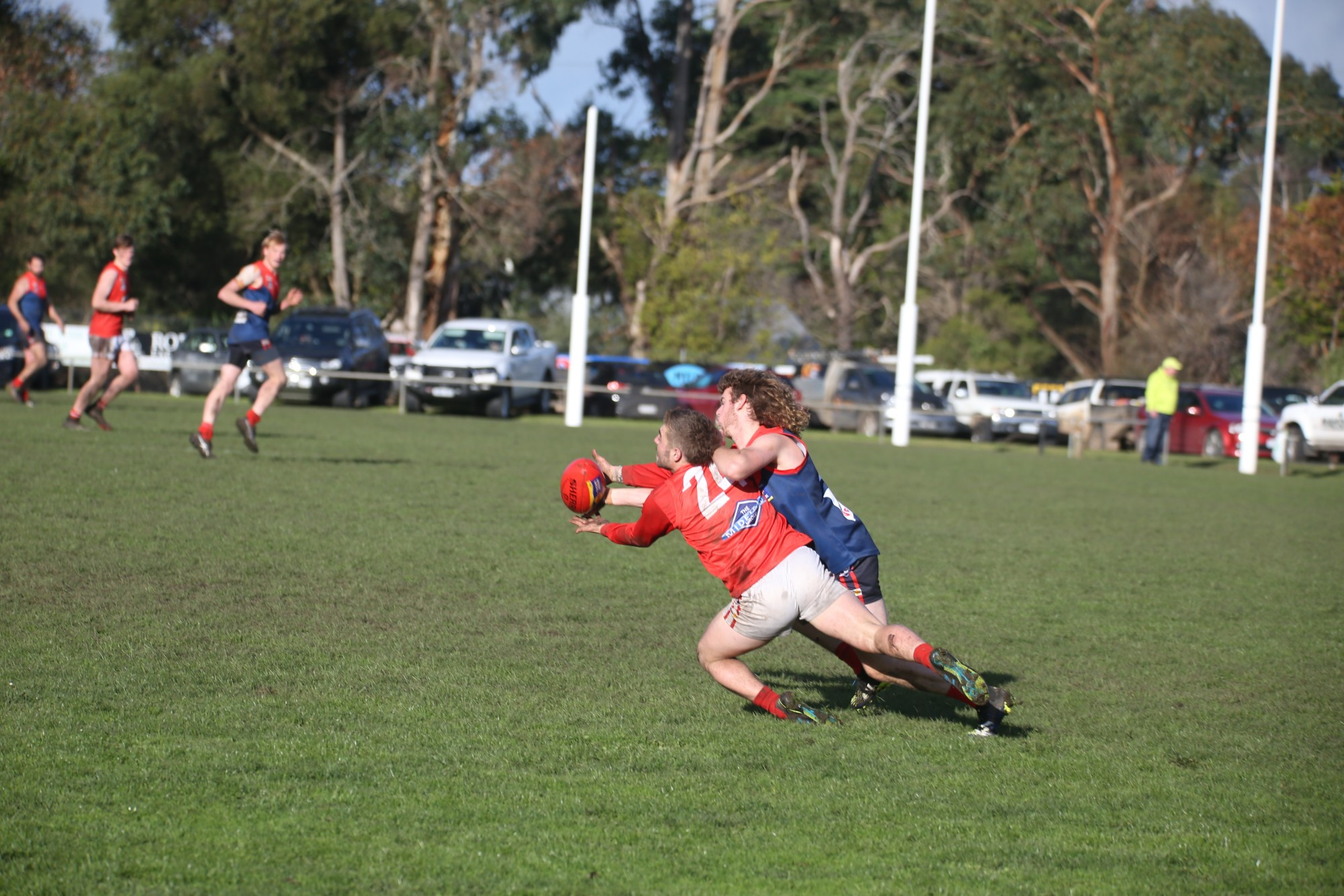 Timboon’s Timothy Smurthwaite puts a strong tackle on his Dennington opponent.