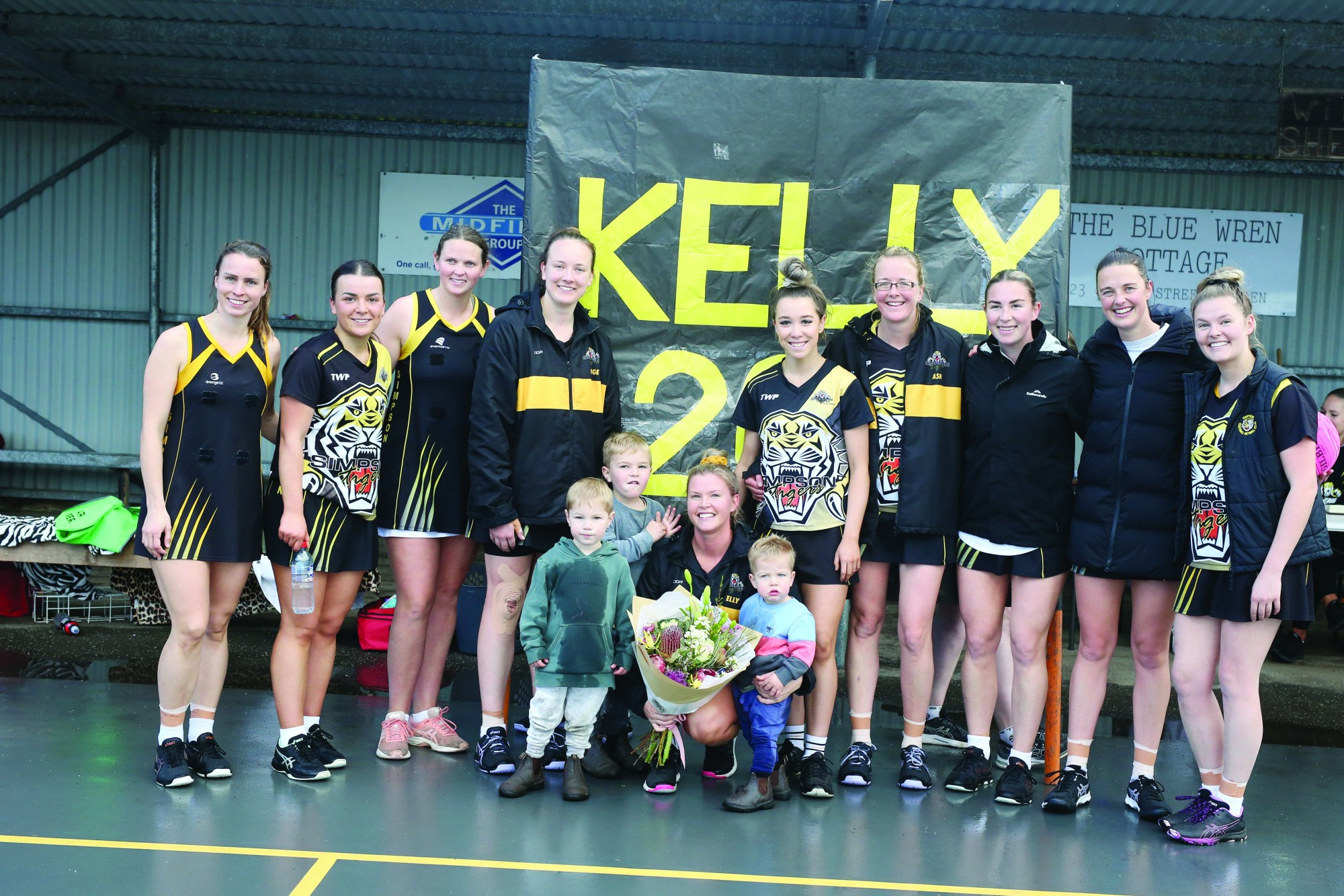 Kelly Thompson shares her special day with her A grade team-mates and her three youngster fans.