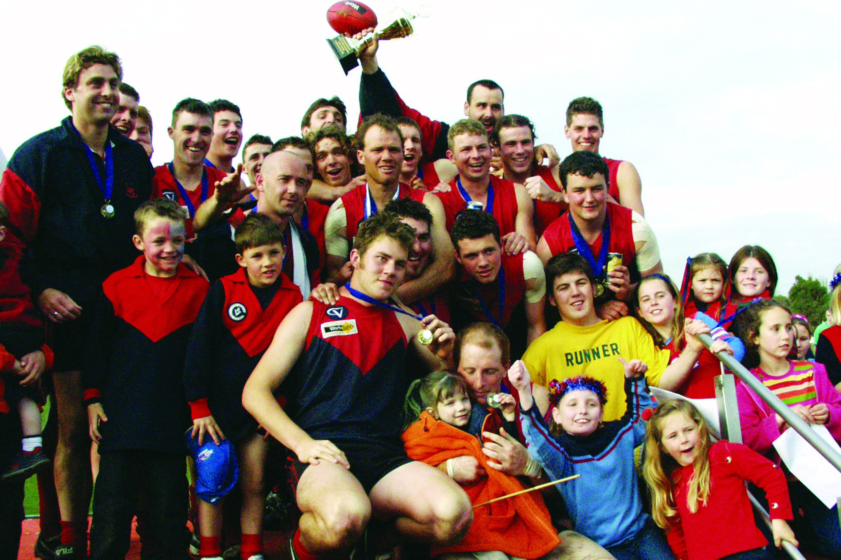 Heytesbury Demon’s senior side celebrate its grand final win over Otway Districts in the 2002 Heytesbury Mt Noorat League.