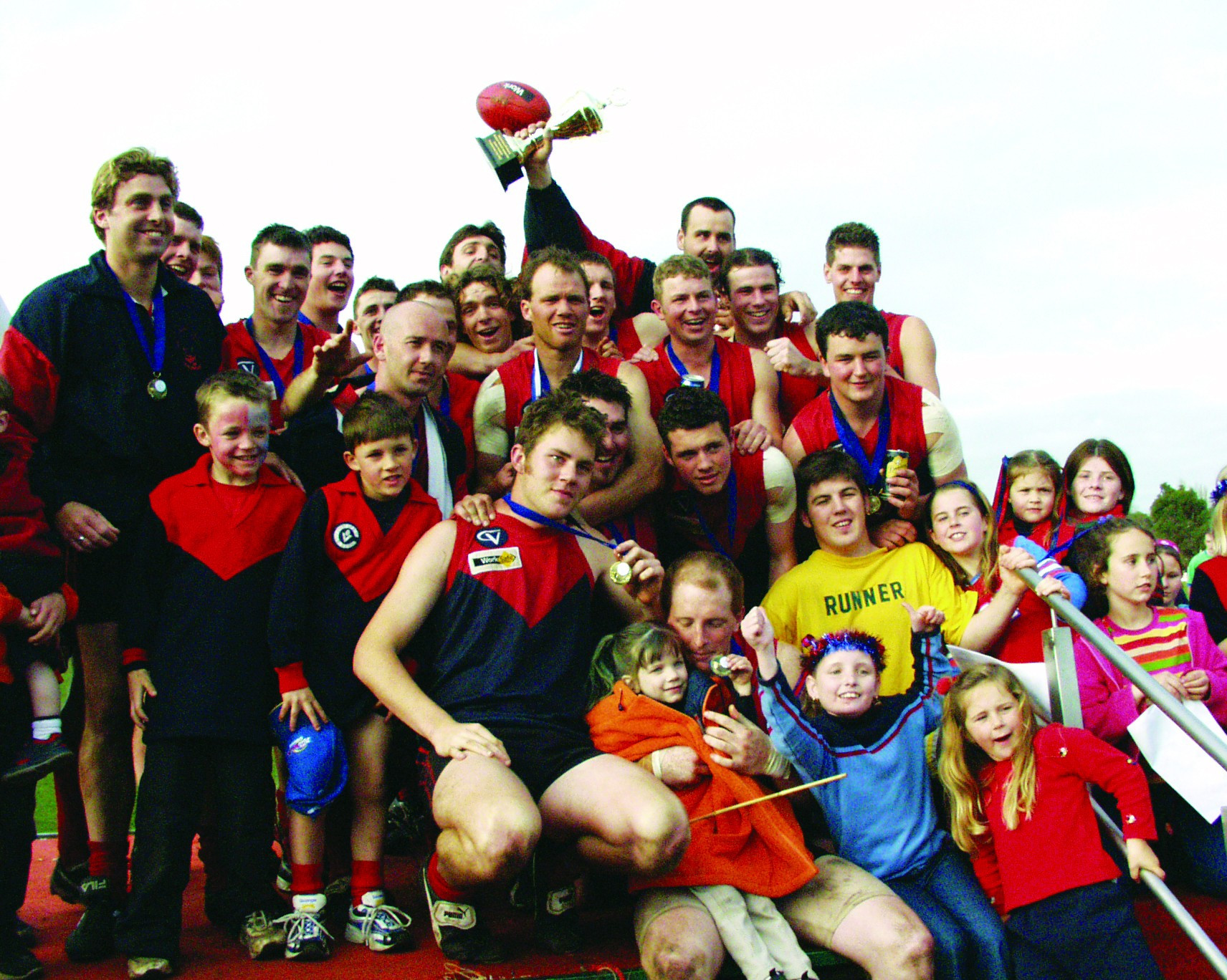 The reserves celebrate after defeating Simpson in 2002.