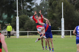 Tom Spokes contests the high ball. 