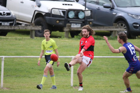 Sam Thow works the ball out of defence. 