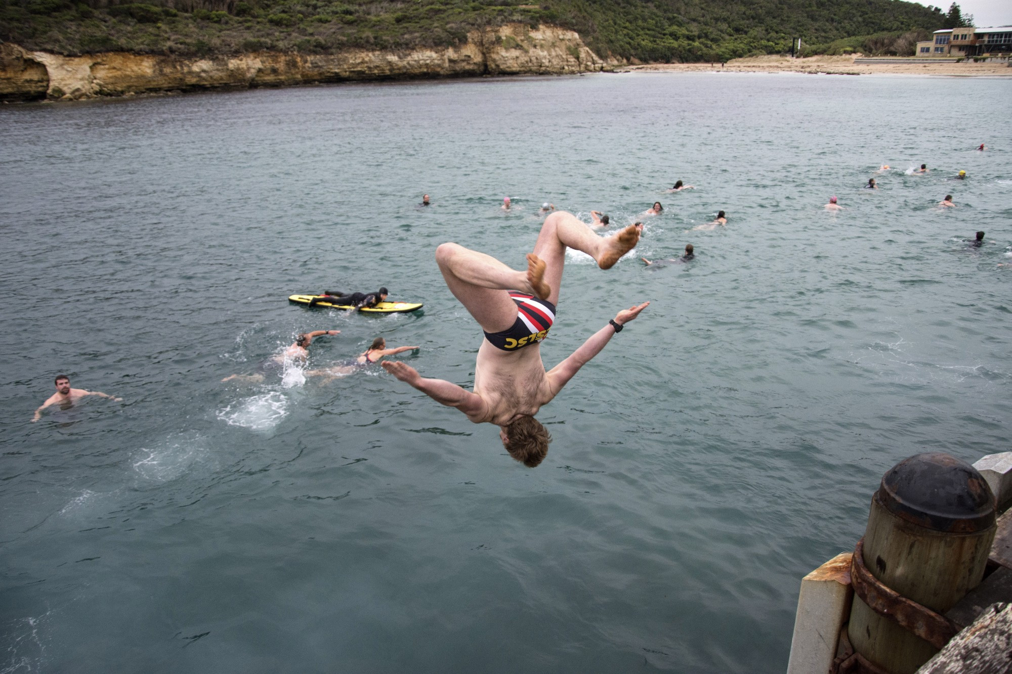 Chill factor: Charlie Trotter makes a grand entrance at the annual Port Campbell winter solstice swim recently. Photo courtesy of Raelene Wicks