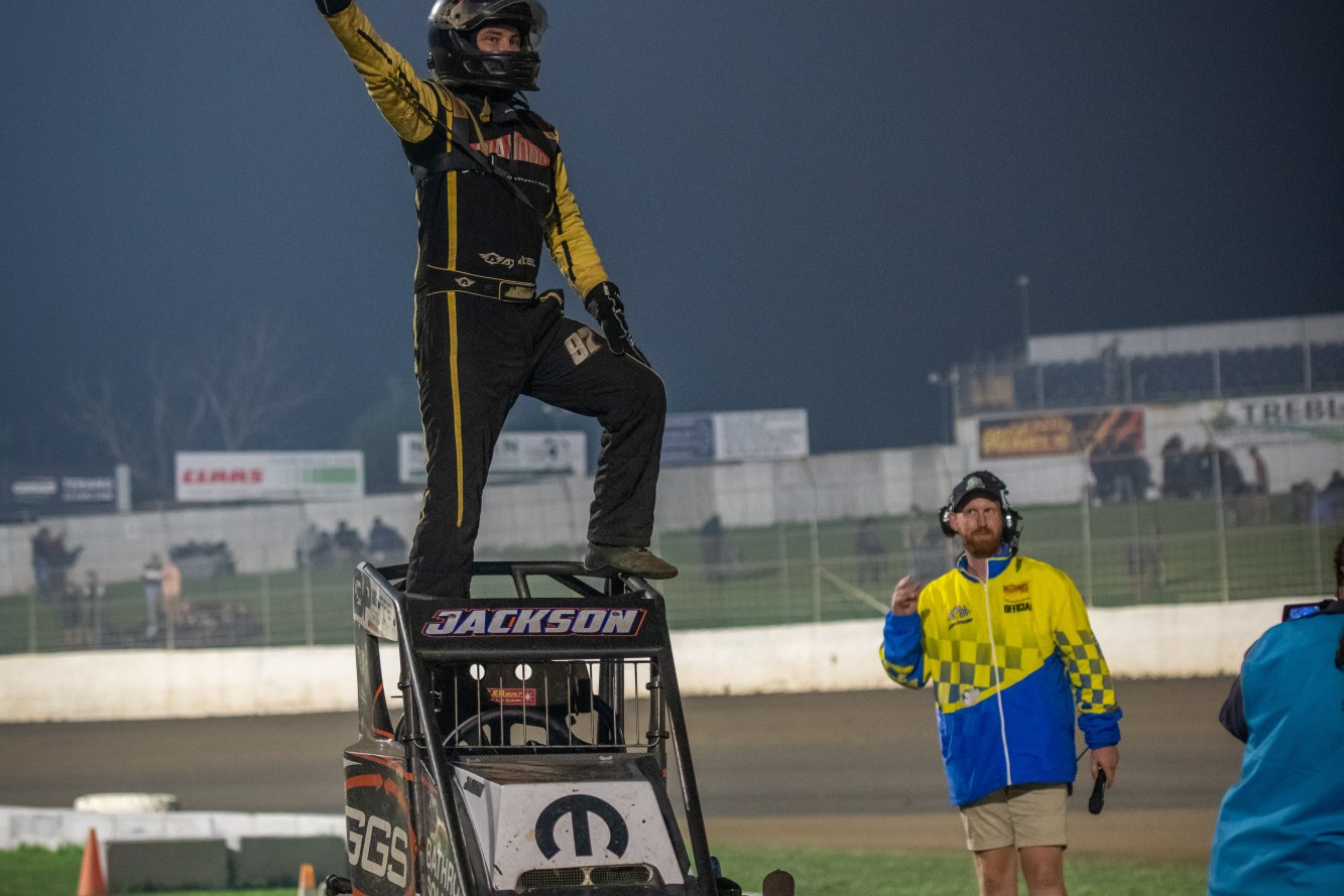 Right: Matt Jackson celebrates his triumph after winning the 2022 Victorian Speedway Championship ahead of multiple title winner Travis Mills. Photo by Aidan Freeman.
