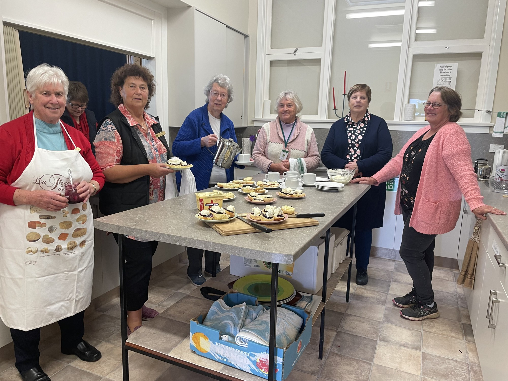 Friendly banter: More than 40 people spent time enjoying a scone or two at a Devonshire tea in Cobden on Monday, in addition to a slew of orders from local businesses.