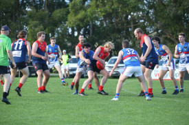 Tim Smurthwaite battles it out for possession. 