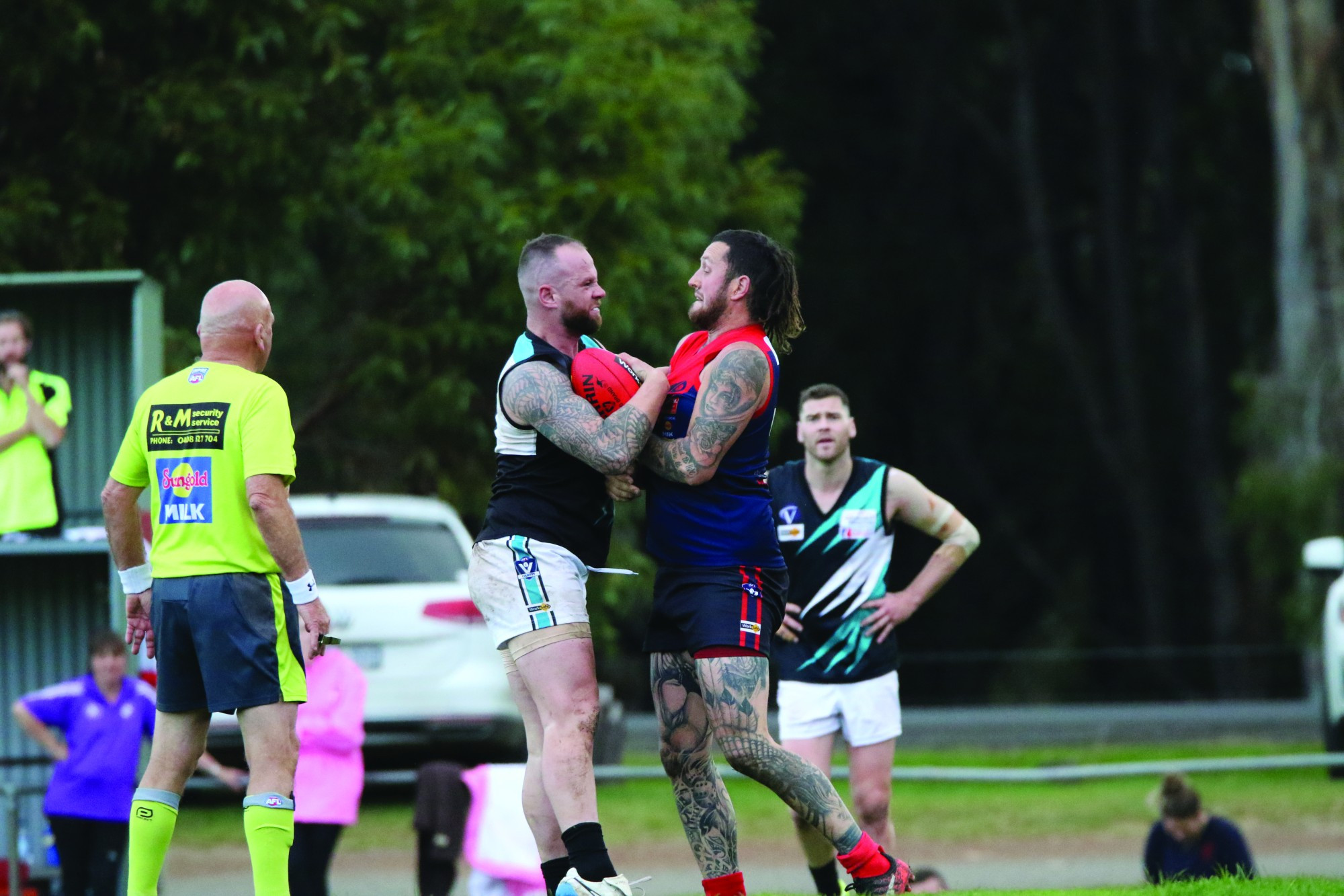 Chests out: Sam Negrello faces some hostility from Power counterpart Bradley Williams.